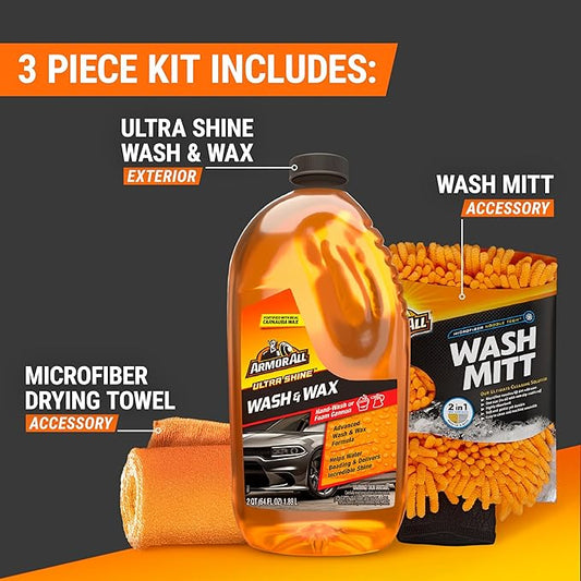 Car care product set with wash and wax, wash mitt, and microfiber towel on a black and orange background.