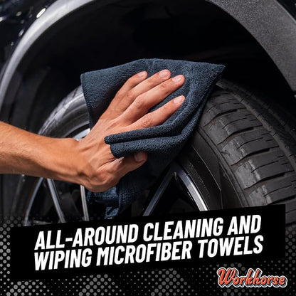 Person cleaning a car tire with a microfiber towel, with 'Workhorse' branding.