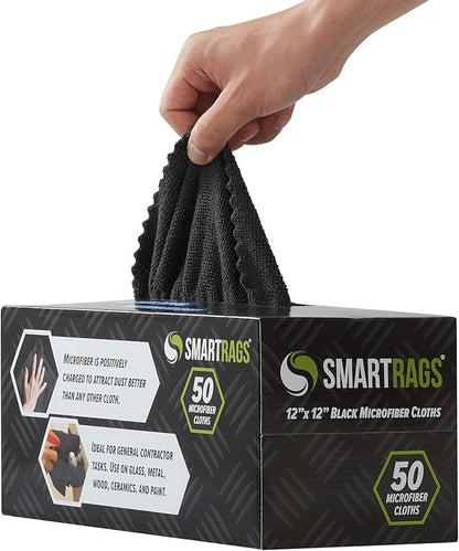 Hand holding a black microfiber cloth above a box of SMARTRAGS microfiber cloths.